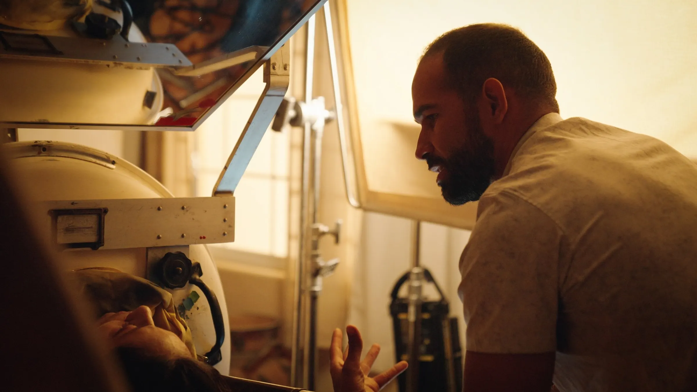 Behind the scenes: a scene is staged around the iron lung.