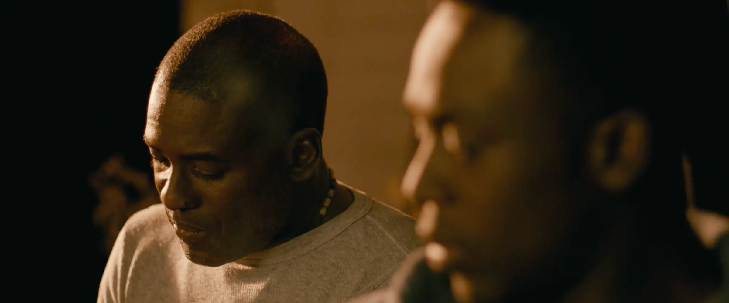 A father and son talk at close quarters.